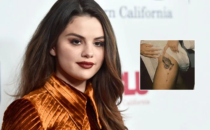 Selena Gomez surpreende fãs com nova tatuagem religiosa perto da virilha