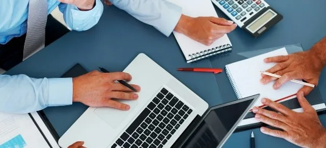 Cropped image of group of businesspeople working together in office - Consulting