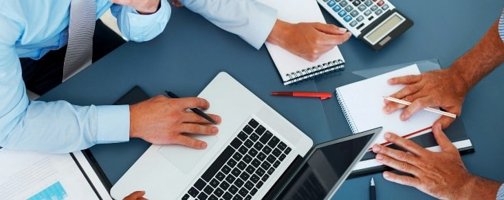 Cropped image of group of businesspeople working together in office - Consulting