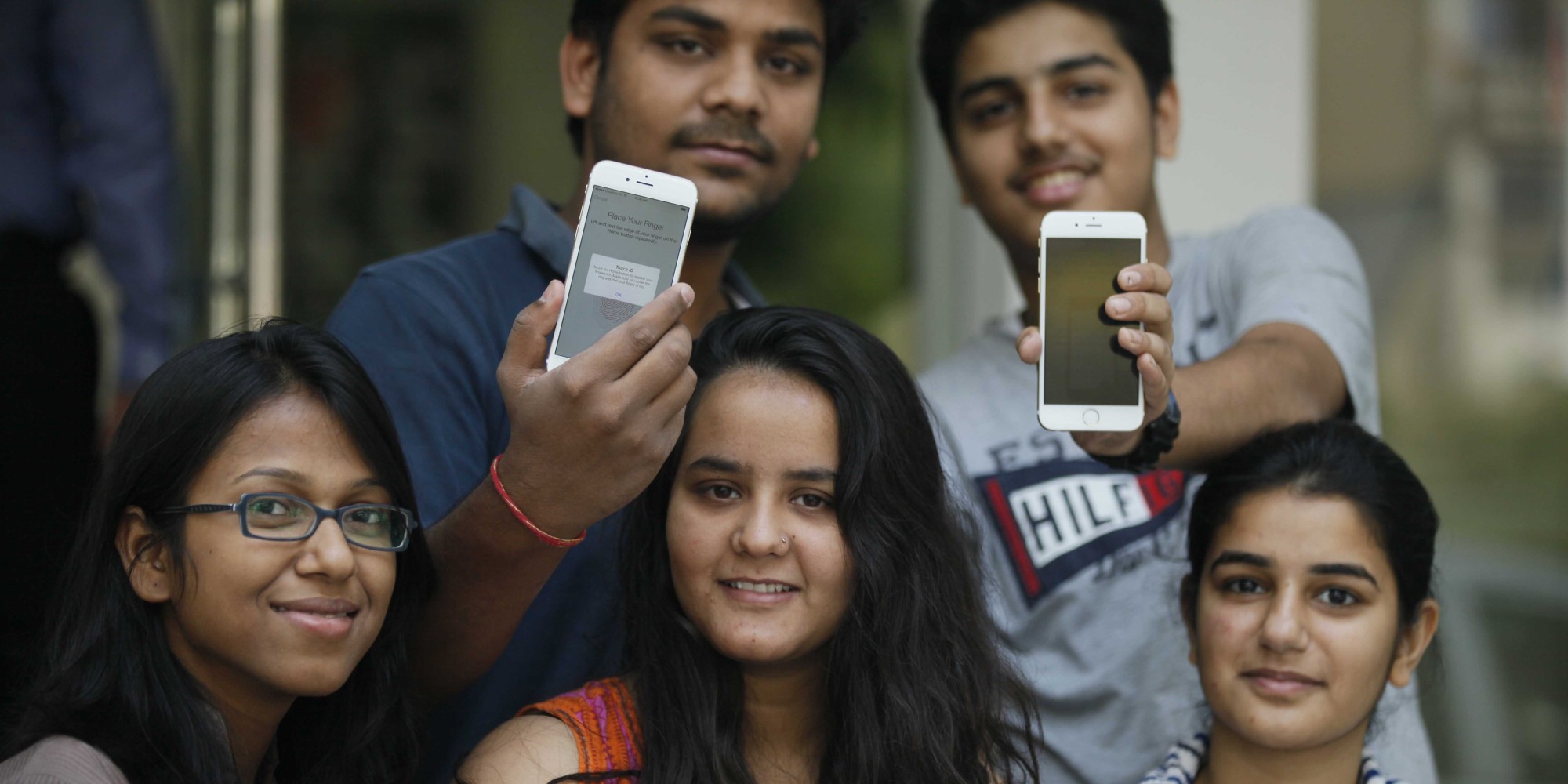 NEW DELHI, INDIA - OCTOBER 17: Apple fans buy newly launched Apple iPhone 6 and iPhone 6 Plus, on October 17, 2014 in New Delhi, India. The 4.7-inch iPhone 6 is available in India at Rs. 53,500 for the 16GB variant, Rs. 62,500 for the 64GB variant, and Rs. 71,500 for the 128GB variant. The 5.5-inch iPhone 6 Plus has been priced at Rs. 62,500 for the 16GB variant, Rs. 71,500 for the 64GB variant, and Rs. 80,500 for the 128GB variant. (Photo by Raj K Raj/Hindustan Times via Getty Images)