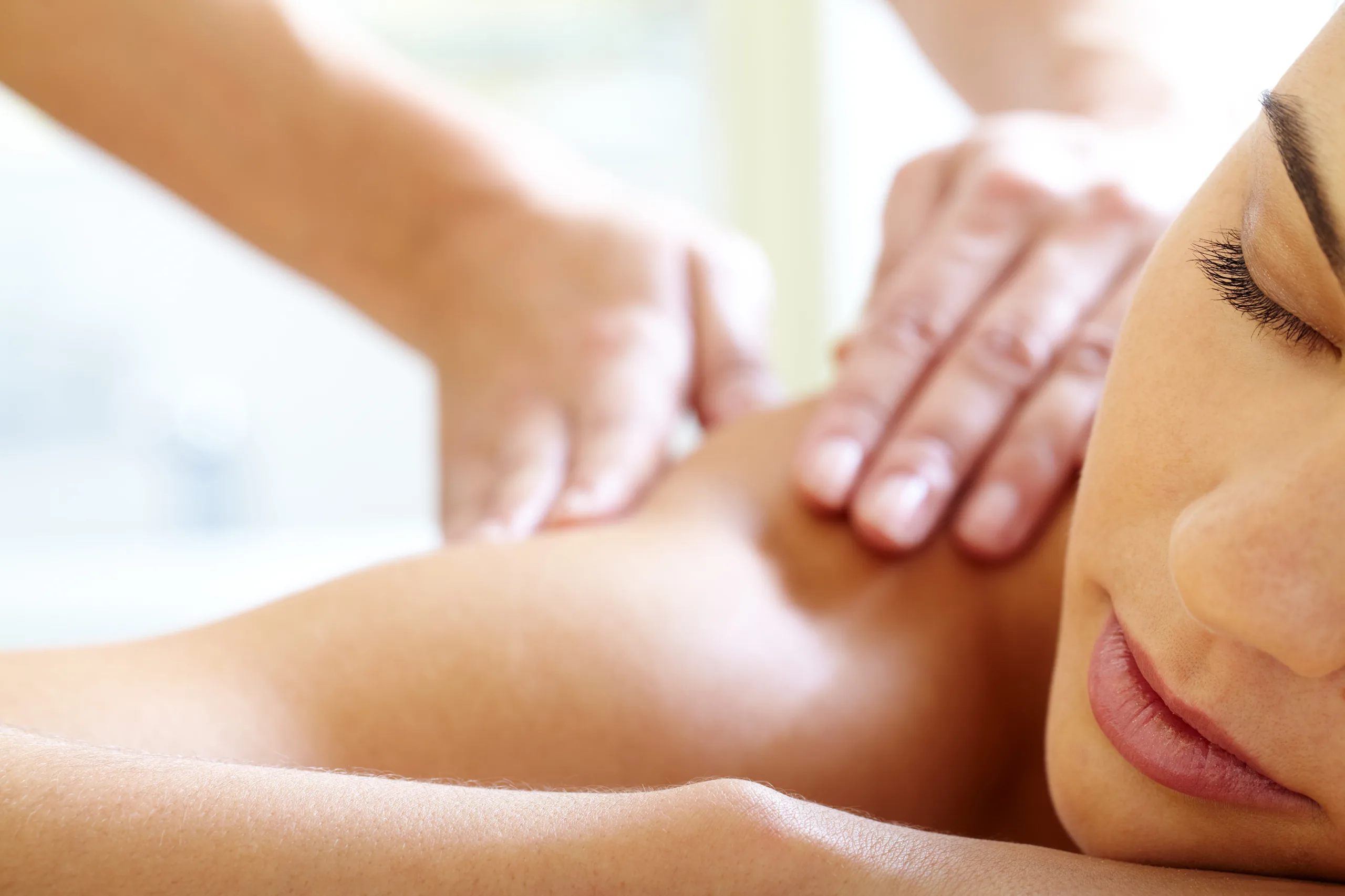 Part of face of calm female during luxurious procedure of massage