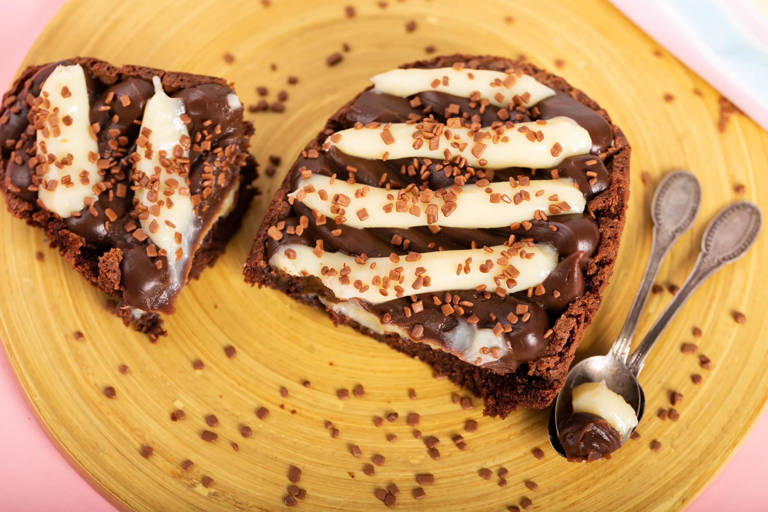 Chocolate egg with filling of brownie for Easter on wooden background. Selective focus 