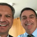 O major da reserva do Exército Angelo Martins Denicoli e o ex-presidente Jair Bolsonaro.
