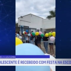 Menino vence leucemia e é recebido com festa na escola