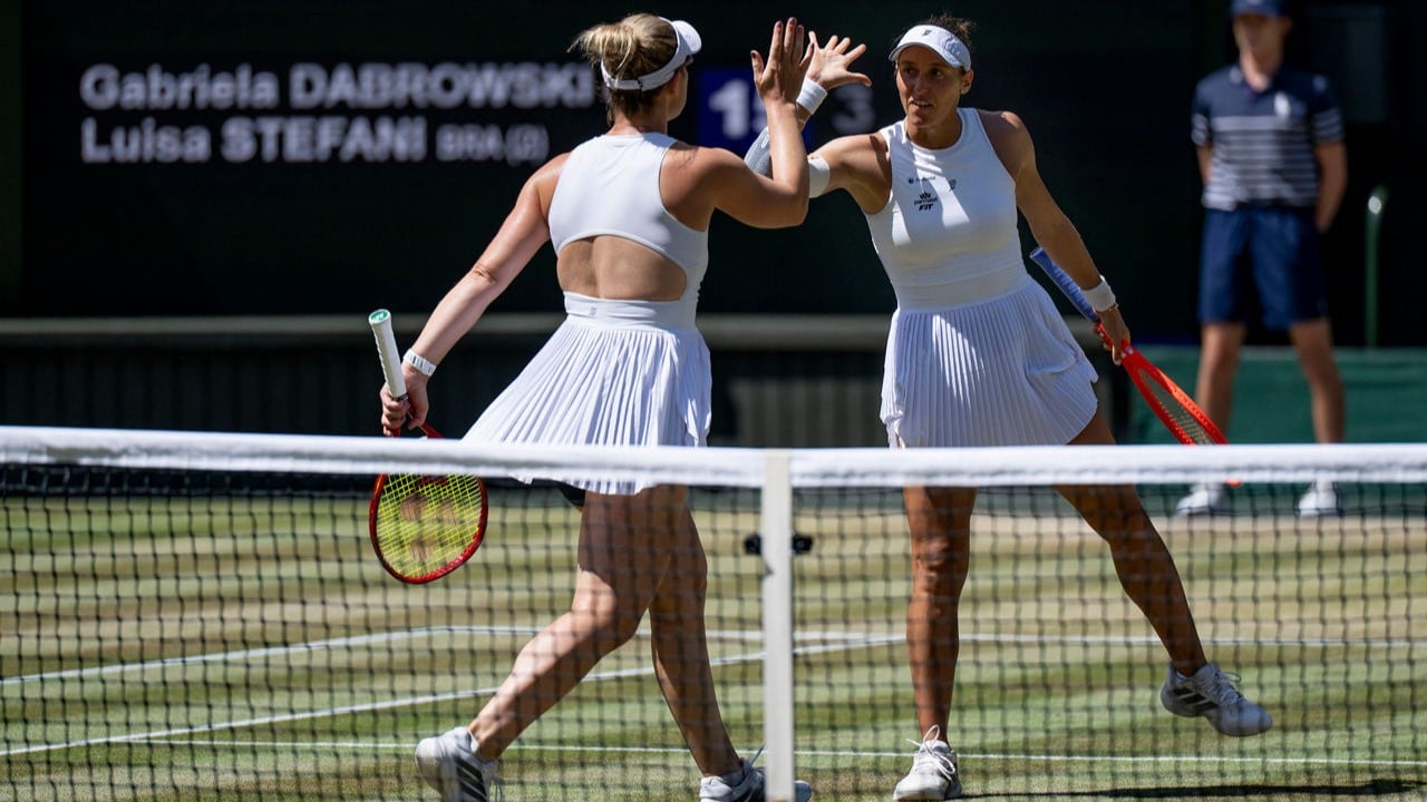 Wimbledon 2026. Gabriela Dabrowski (CAN) and Luisa Stefani (BRA) celebrate winning a point against Hanyu Guo (CHN) and Kristina Mladenovic (FRA) in the final match of the Ladies' Doubles

AELTC/Joel Marklund